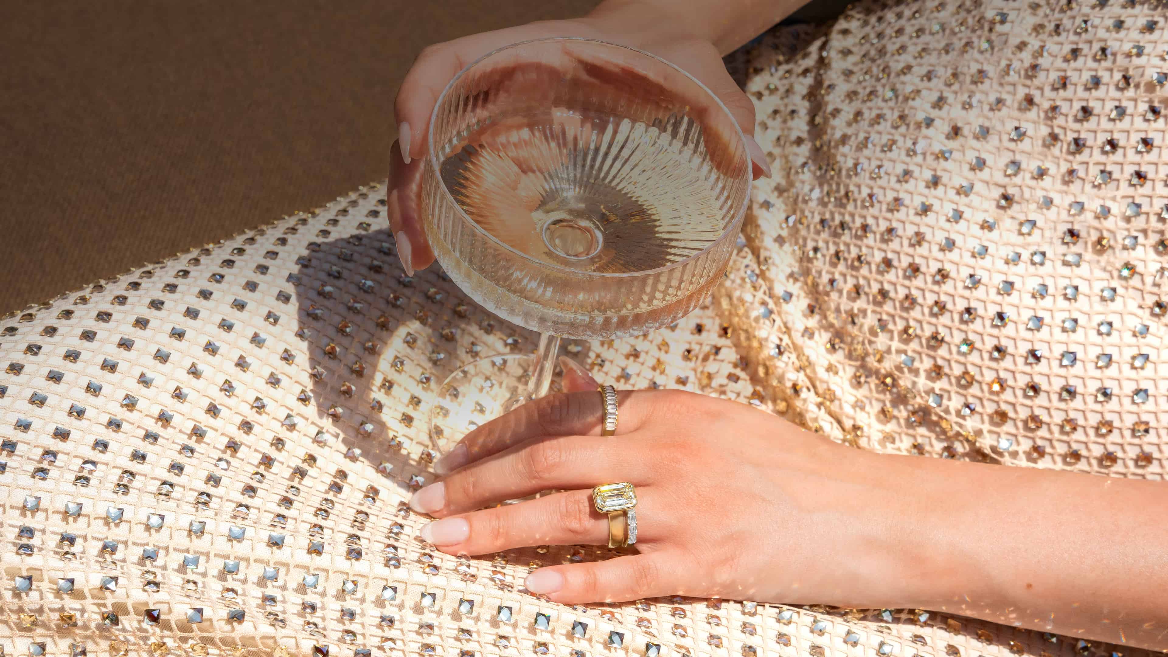 A close-up of an engagement ring with text overlay reading 'Find the Perfect Ring, Make it yours' against a dark background