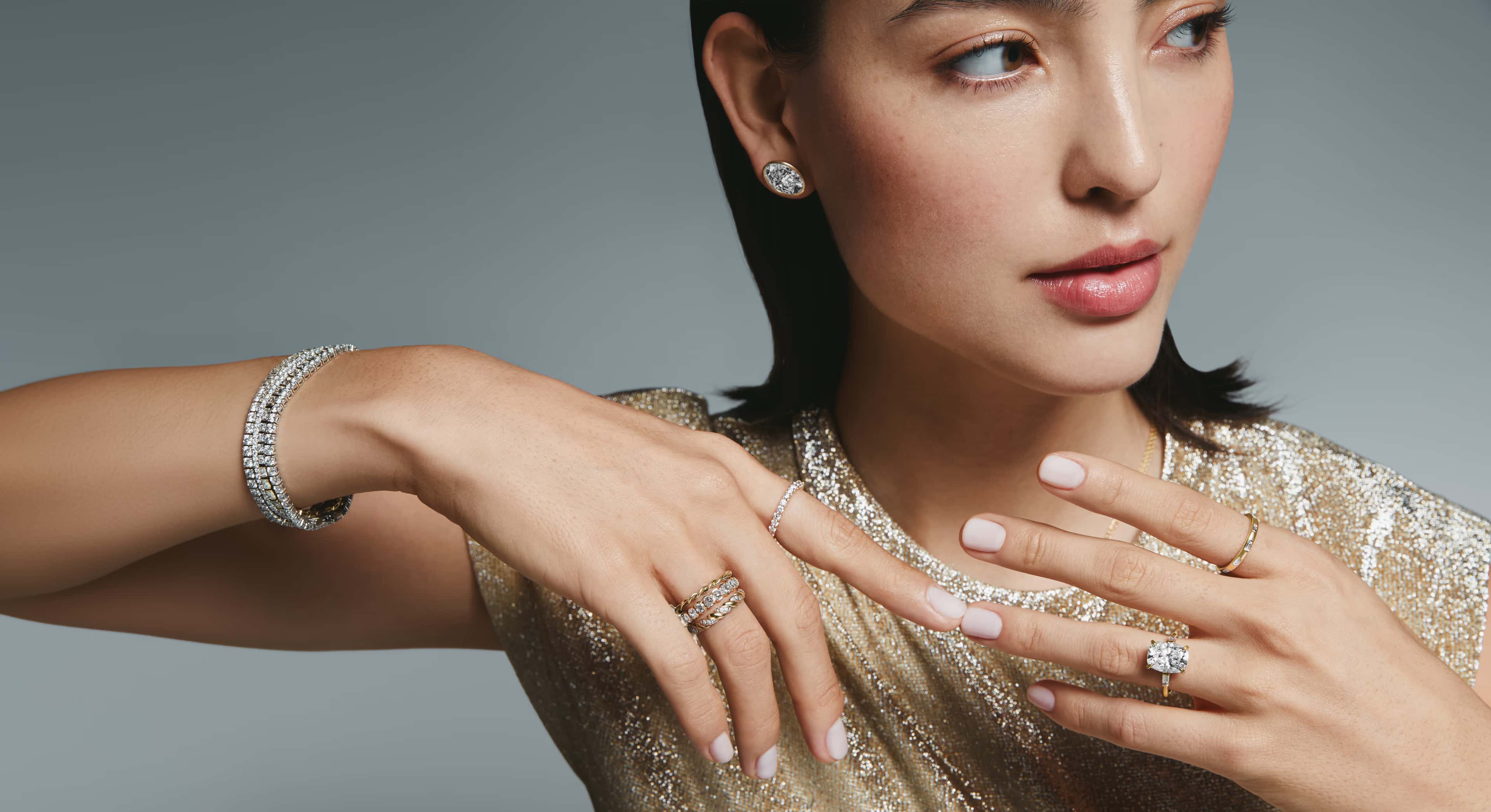 A close-up of an engagement ring with text overlay reading 'Find the Perfect Ring, Make it yours' against a dark background