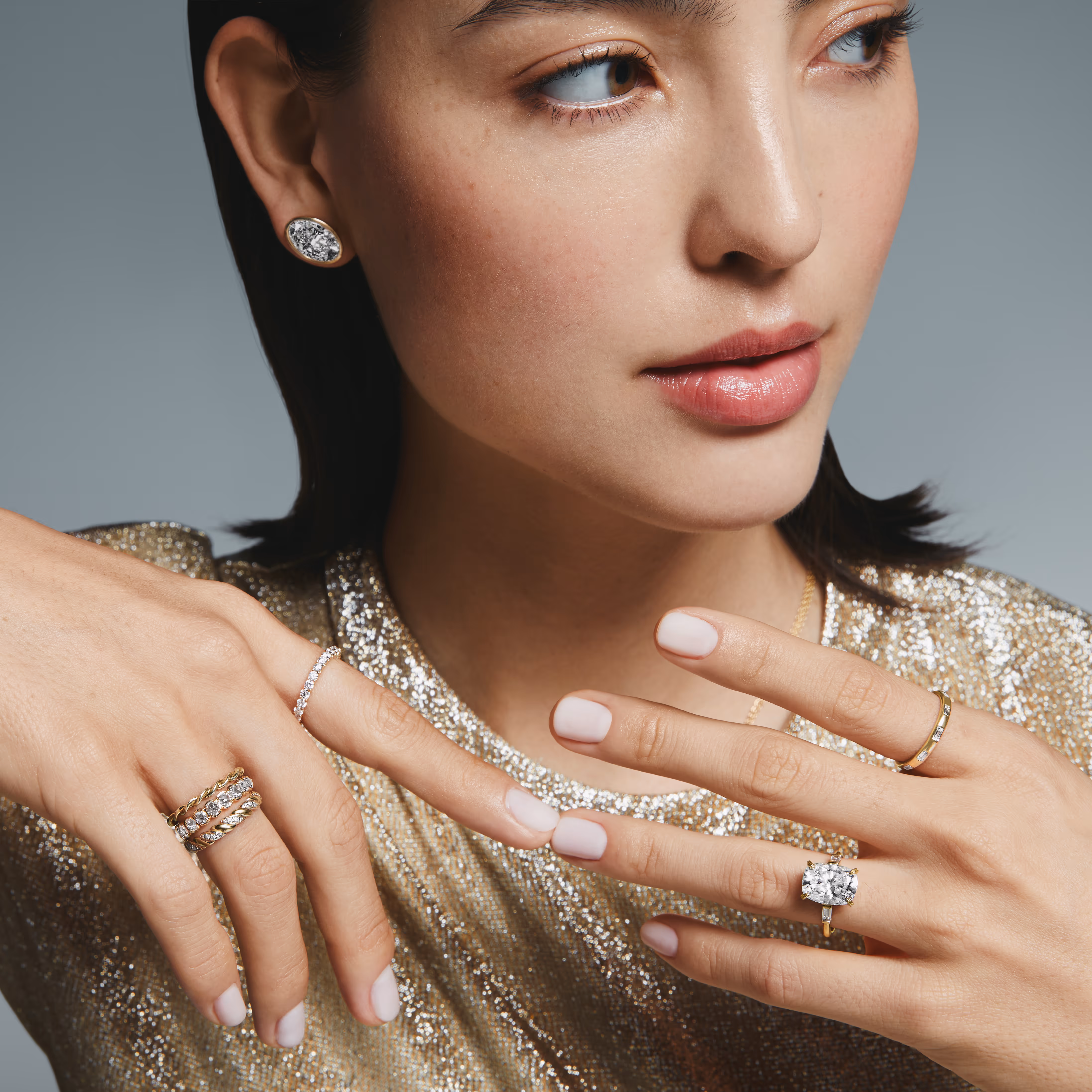 A close-up of an engagement ring with text overlay reading 'Find the Perfect Ring, Make it yours' against a dark background