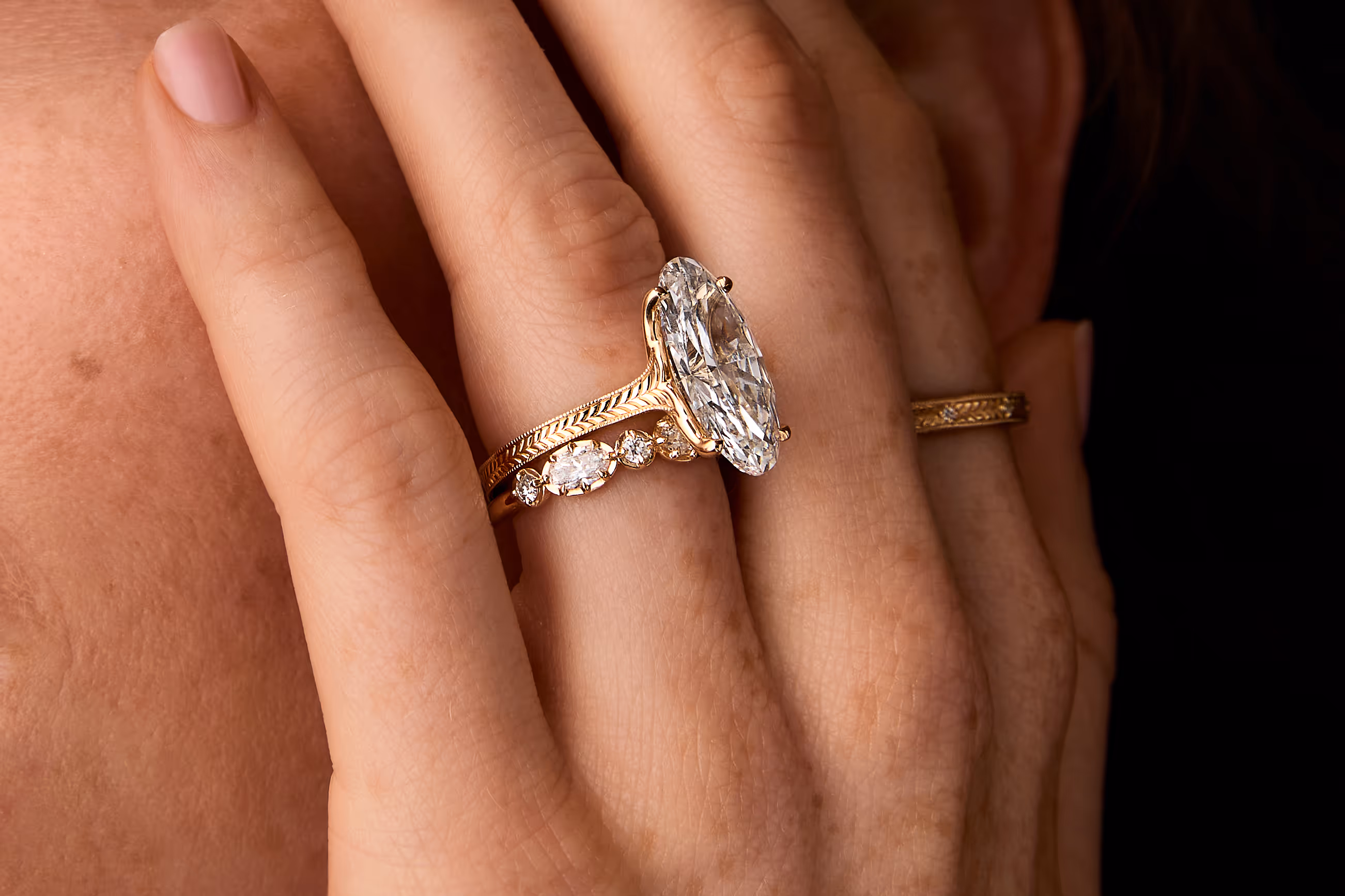 The Quill showcase featuring a lifestyle image of an engagement ring