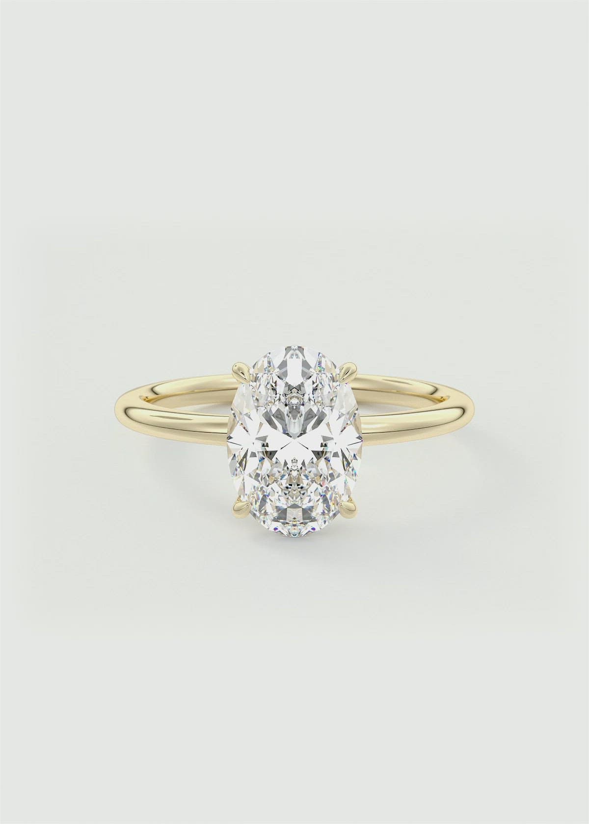 Minimalist Oval Solitaire with Signature Scoop Setting by Frank