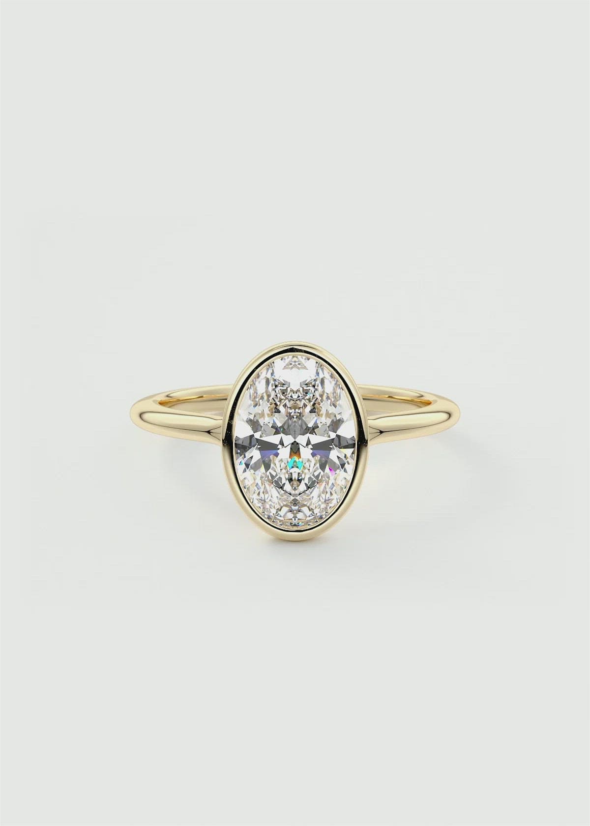 Modern Oval Cut Bezel Set Engagement Ring by Frank Darling